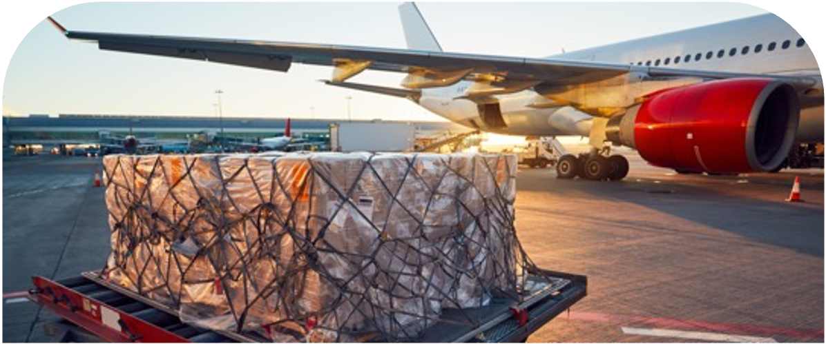 A wrapped load sits next to the wing of a freight plane before being loaded on