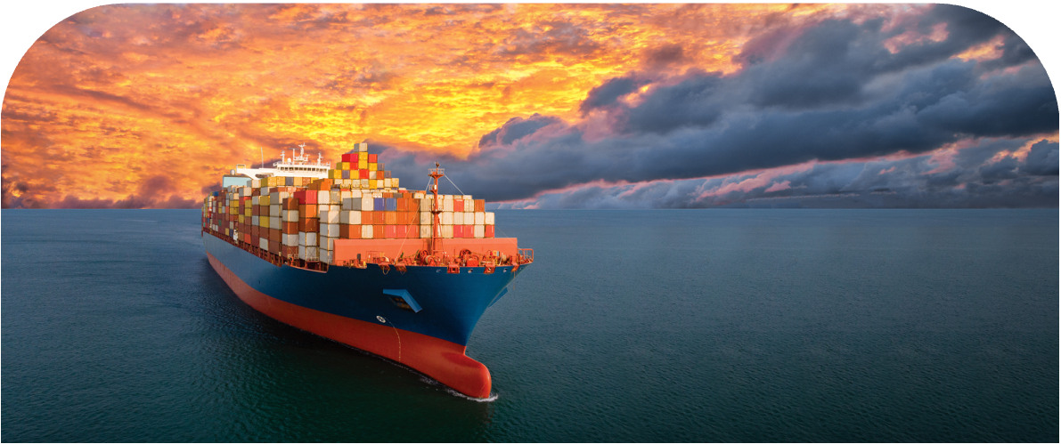 A freight ship sailing at sunset A freight ship sailing at sunset